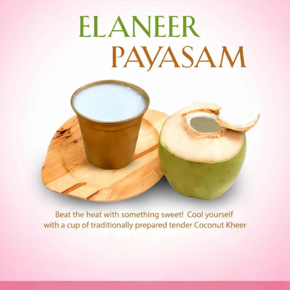 Rhukra Cake House Elaneer Payasam served in a cup with a fresh tender coconut on a wooden board