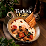 Rhukra Cake House Turkish Eggs with poached eggs, sauteed mushrooms, cherry tomatoes, and toast on a ceramic plate.