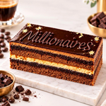 Rhukra Cake House Millionaires eggless chocolate cake with caramel and ganache layers on a marble serving board